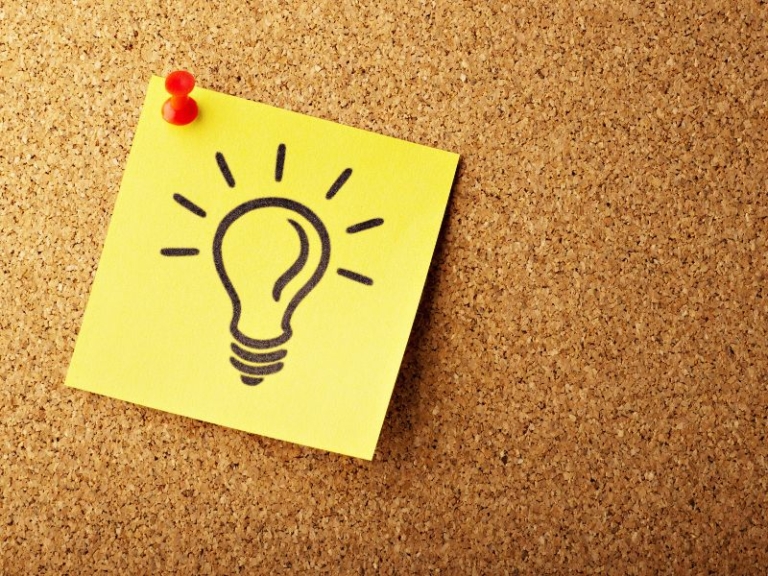 Light bulb drawing on a sticky note