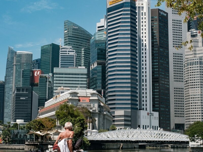 Singapore CBD professional with bicycle by Marina Bay