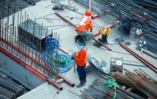 Construction workers at a Singapore building site Work Permit MYE DRC 2026