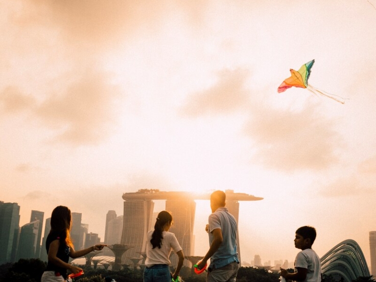 Family reviewing LTVP vs LTVP+ Singapore 2026 immigration documents