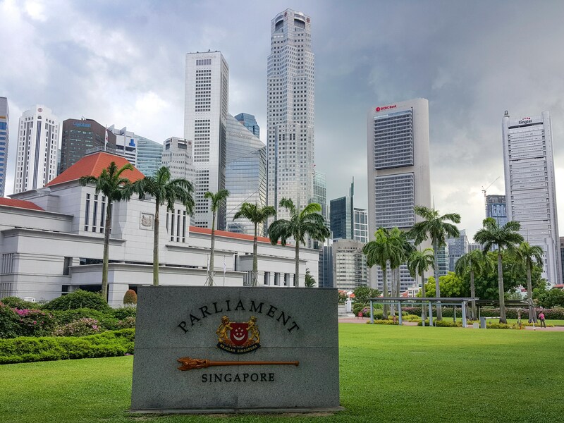 Foreign worker reviewing a Special Pass in Singapore document with an HR officer