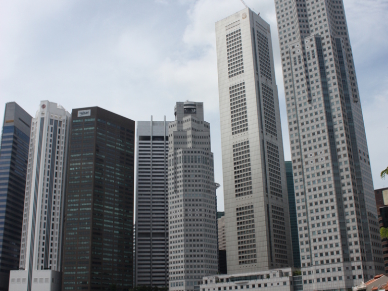 Singapore CBD skyline representing the property market employers consider when hiring a foreign real estate agent Singapore agencies sponsor