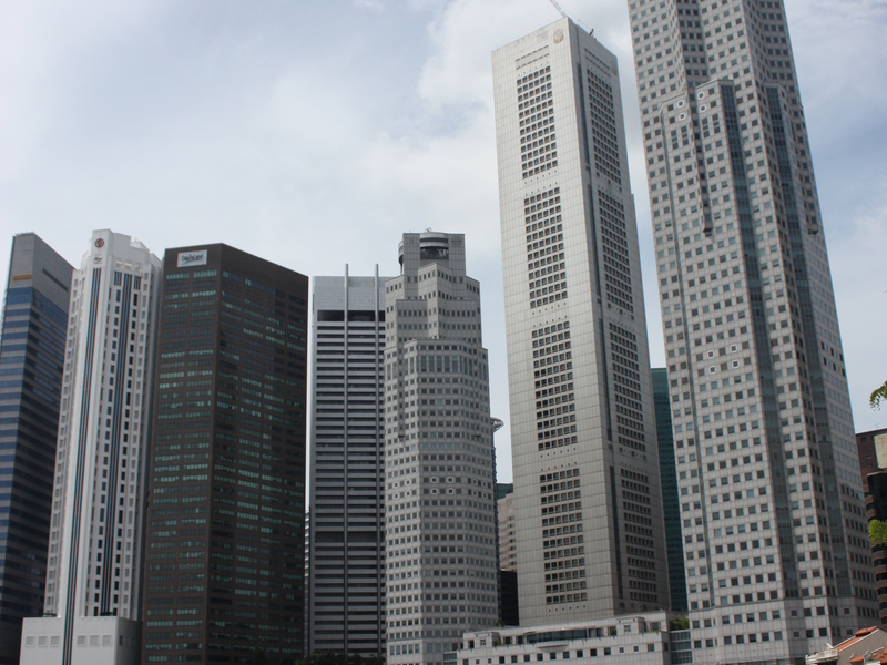 Singapore CBD skyline representing the property market employers consider when hiring a foreign real estate agent Singapore agencies sponsor