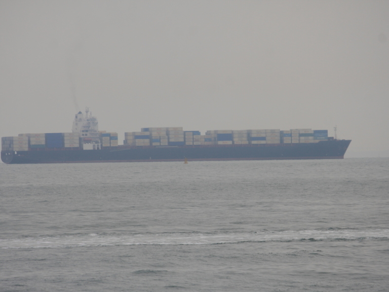 Hiring a foreign ship captain in Singapore - container ship in Singapore Harbour