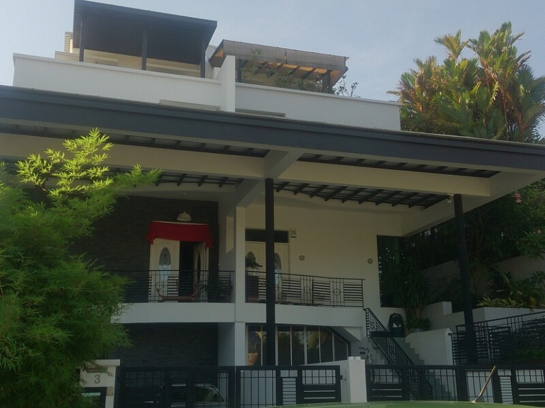 House with a sheltered terrace and landscaped garden