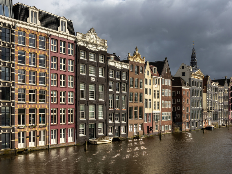 Relocating from the Netherlands to Singapore guide: canal houses in Amsterdam representing the Dutch professional move to Singapore
