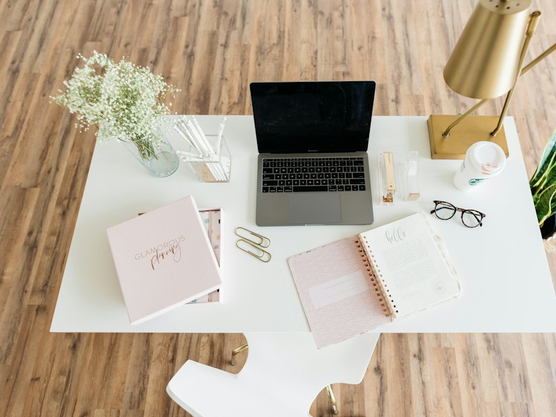 Laptop computer open on a white table