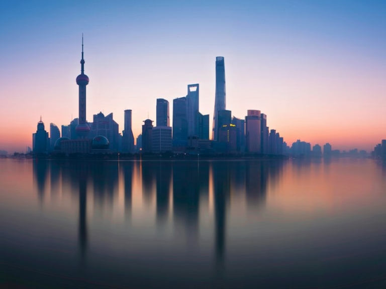The Lujiazui skyline in Shanghai reflected in the Huangpu River, seen from the Bund