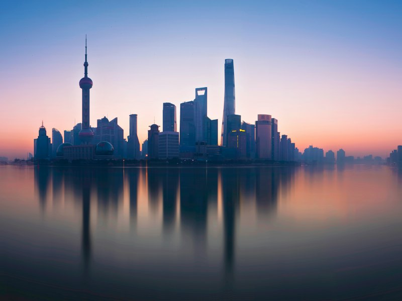 The Lujiazui skyline in Shanghai reflected in the Huangpu River, seen from the Bund