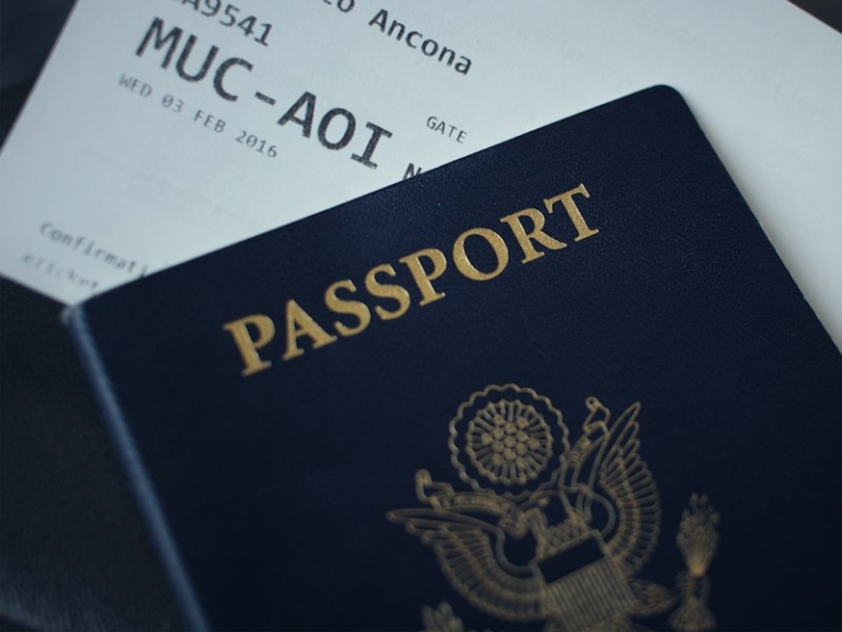 Passport booklet resting on a sheet of white paper